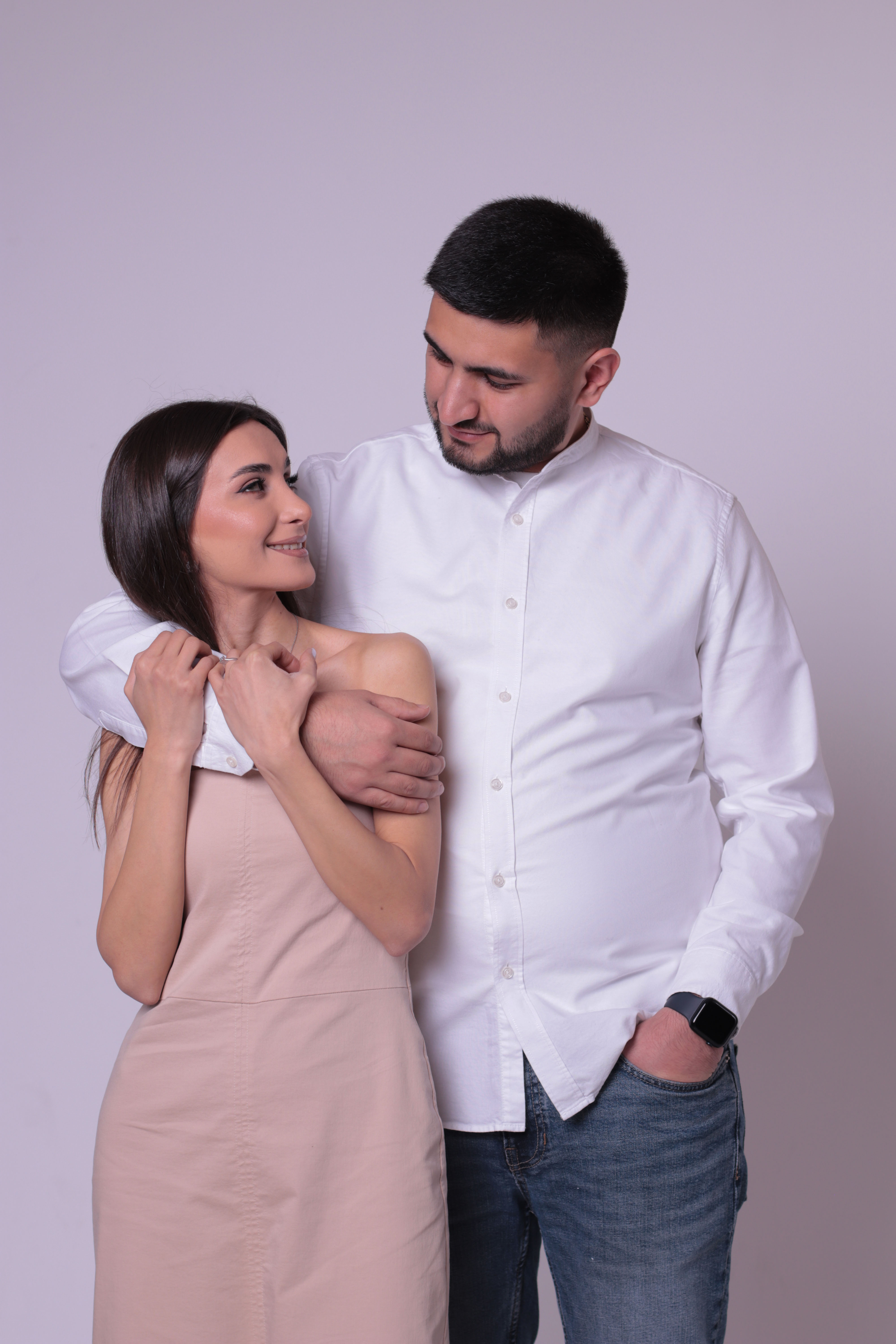 Couple walking through a garden at golden hour